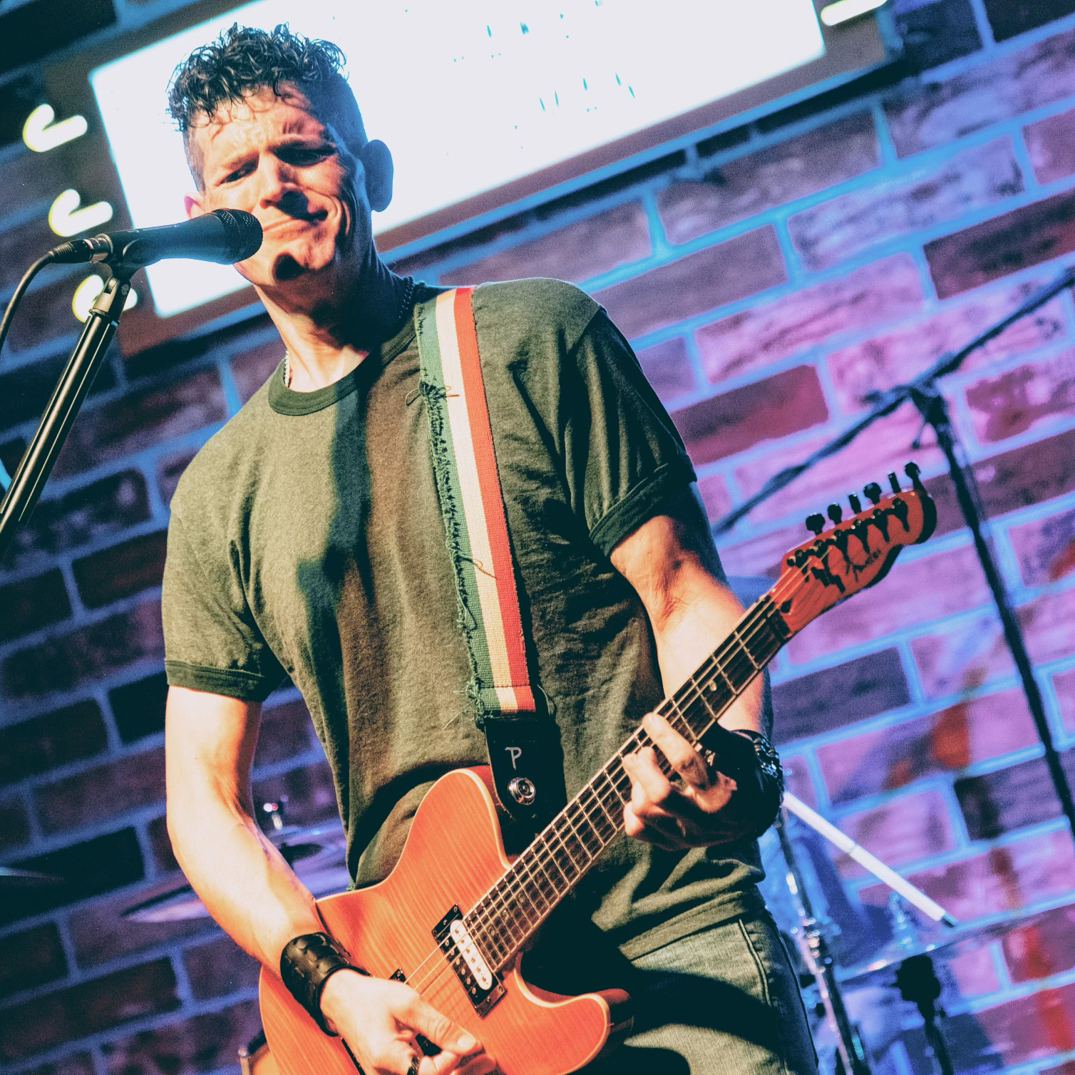 Guitarist Jonathan Haggard of Champagne Lipsmack performing on stage